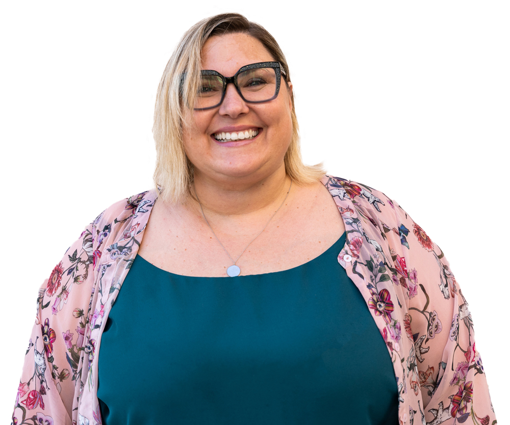 Woman with medium-length blonde hair and wearing glasses, smiling against a white background.